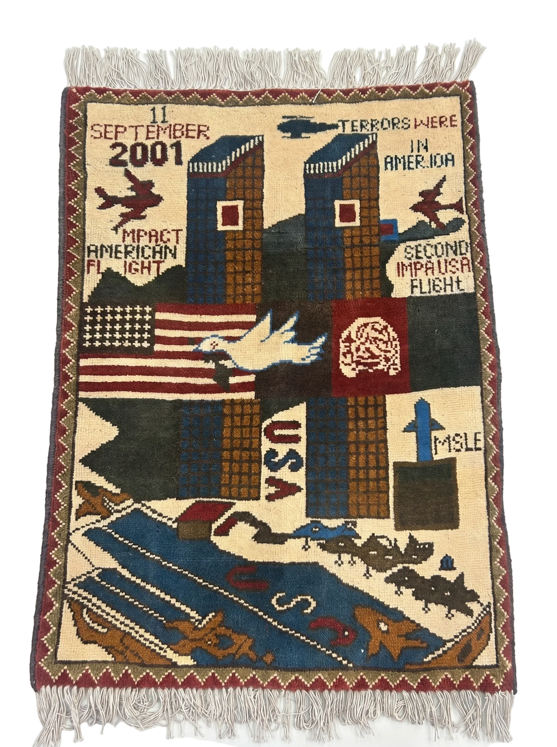 9/11 commemoration Afghan war rug detail showing September 11th iconography