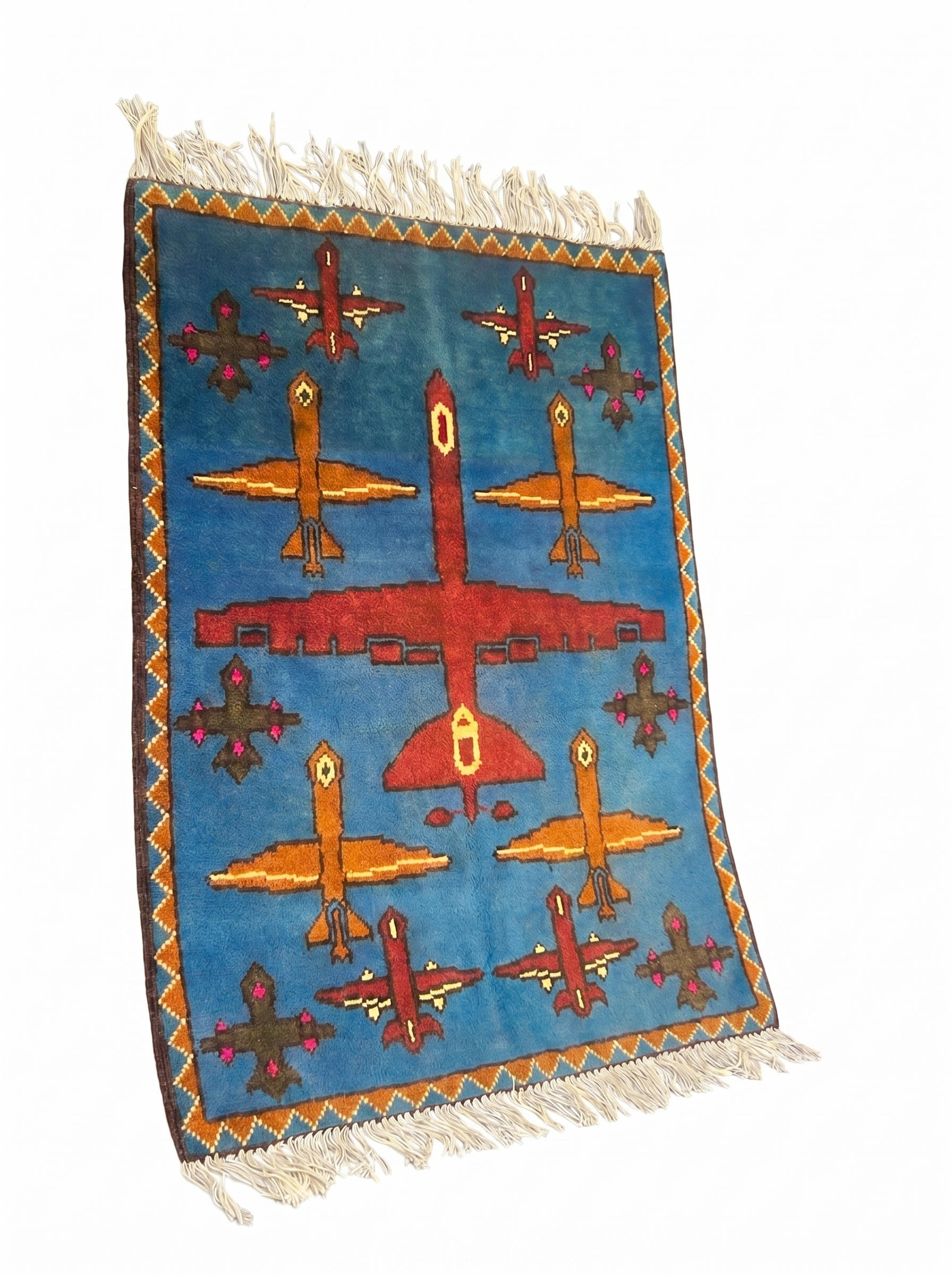 Drone Afghan war rug detail showing handmade wool weave and aircraft motifs