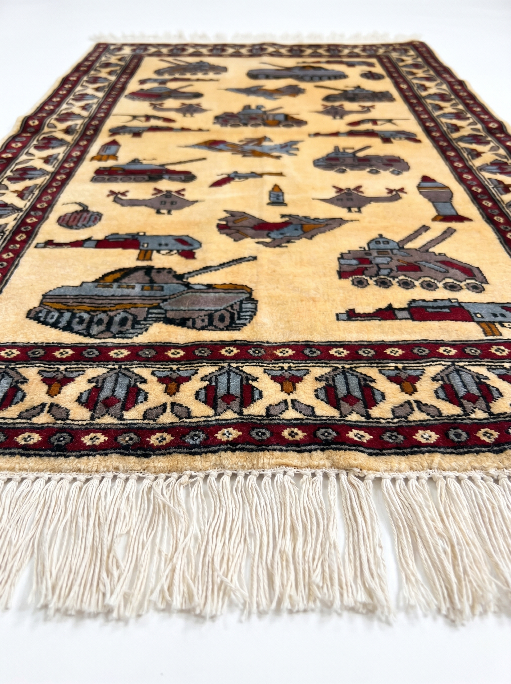 Handmade Soviet–Afghan war rug featuring AK-47s and aircraft on wool